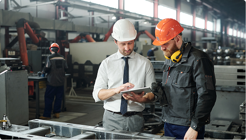 Quality technician inspecting robotic assembly equipment